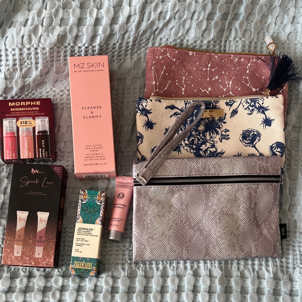 Assorted facial products and Ipsy bags